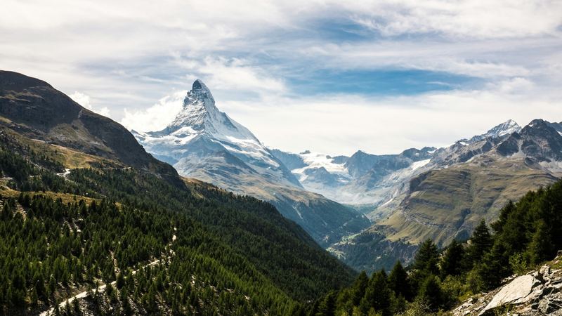 The Matterhorn above the larch forests of the Zermatt valley in summer