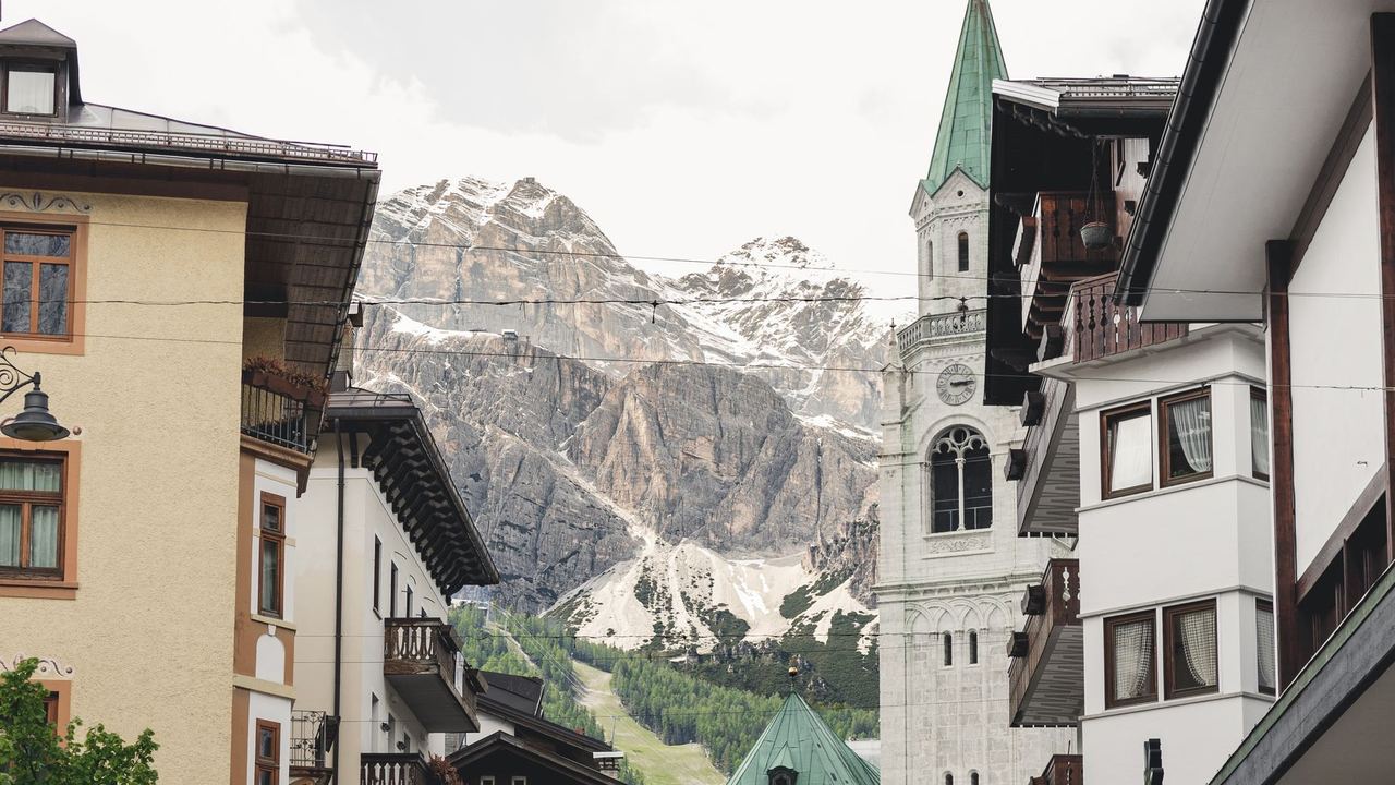 The bell tower and the Tofane above the old centre of Cortina d'Ampezzo