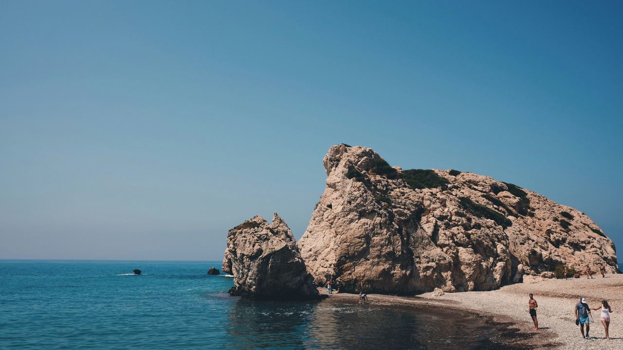 Aphrodite's Rock, Petra tou Romiou, rising from a calm blue sea on the coast near Paphos