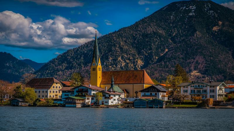 The church of St. Laurentius, boathouses and villas of Rottach-Egern on the Tegernsee