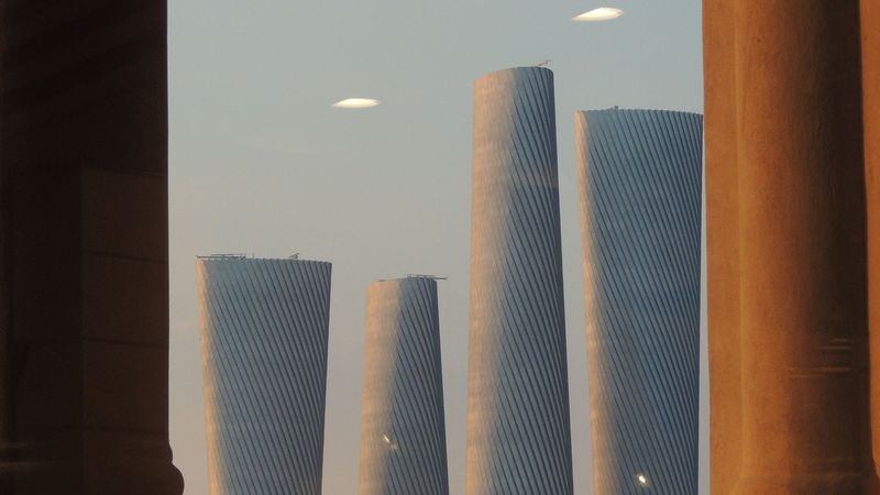 The Lusail towers framed by a colonnade at sunset
