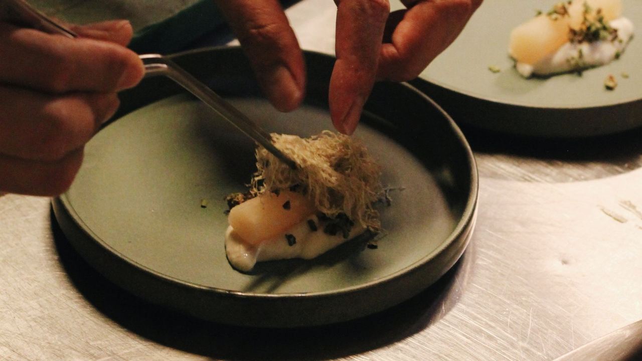 Chefs plating at the pass
