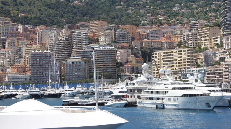 Superyachts moored in Port Hercule below the apartment towers of Monte-Carlo