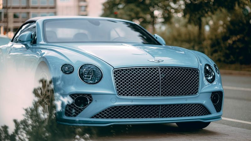 A pale-blue Bentley Continental GT