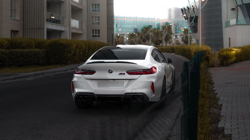 A white BMW M8 Competition Gran Coupé