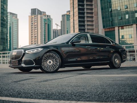 A Mercedes-Maybach S-Class among glass towers