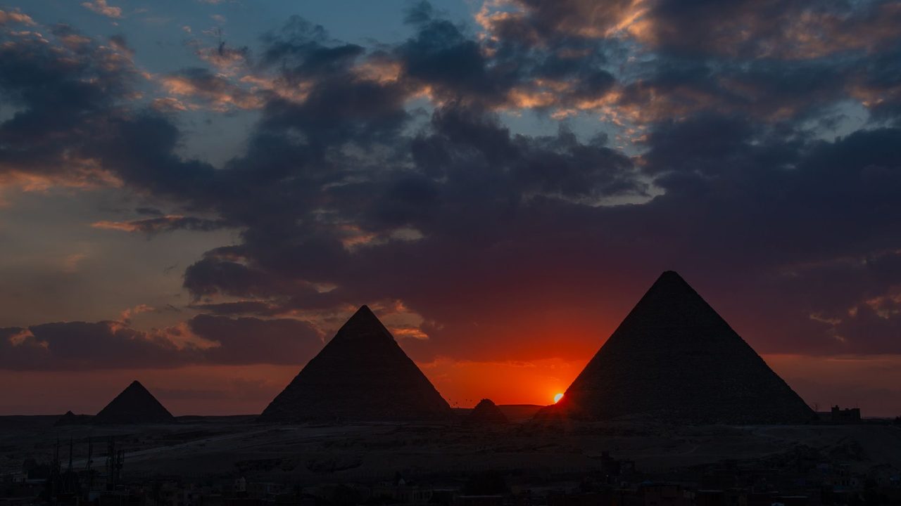 The pyramids of Giza against the setting sun