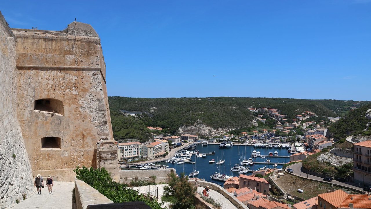 The citadel walls of Bonifacio above the harbour and its yachts