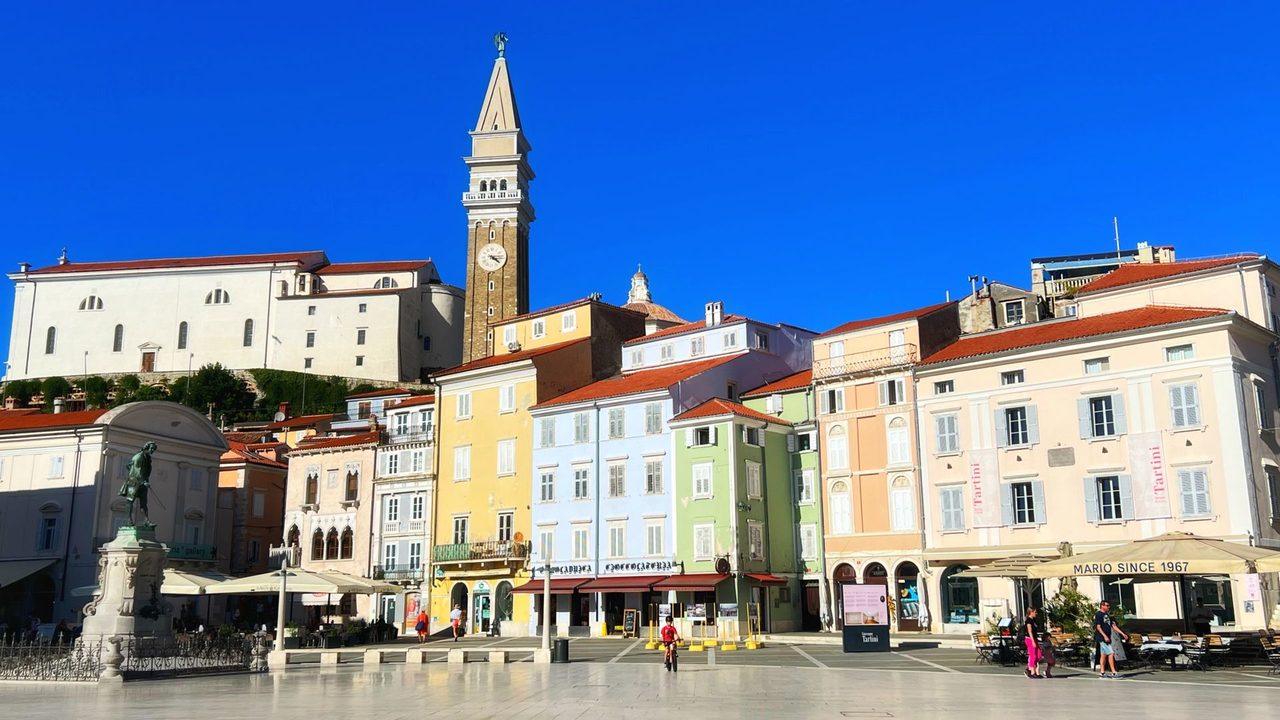 Tartini Square in Piran, its pastel palazzi and the bell tower of St George above