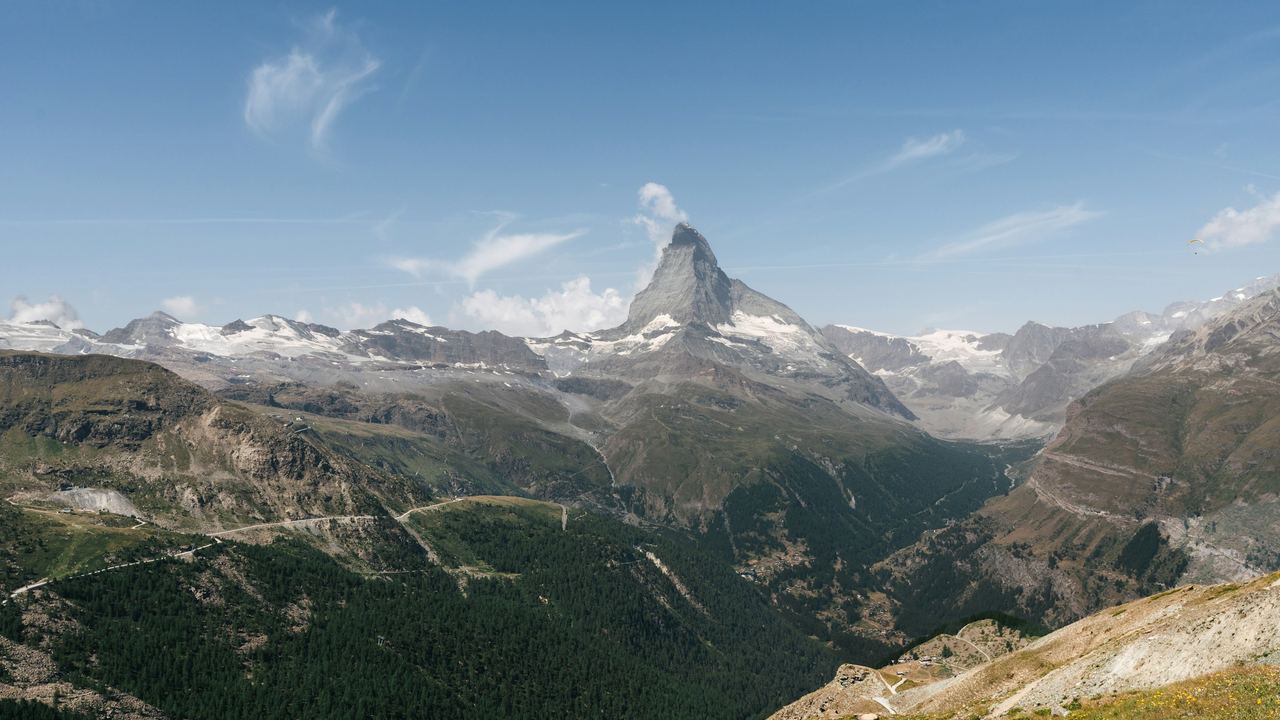 The Matterhorn above the larch forests of the Zermatt valley on a clear summer day